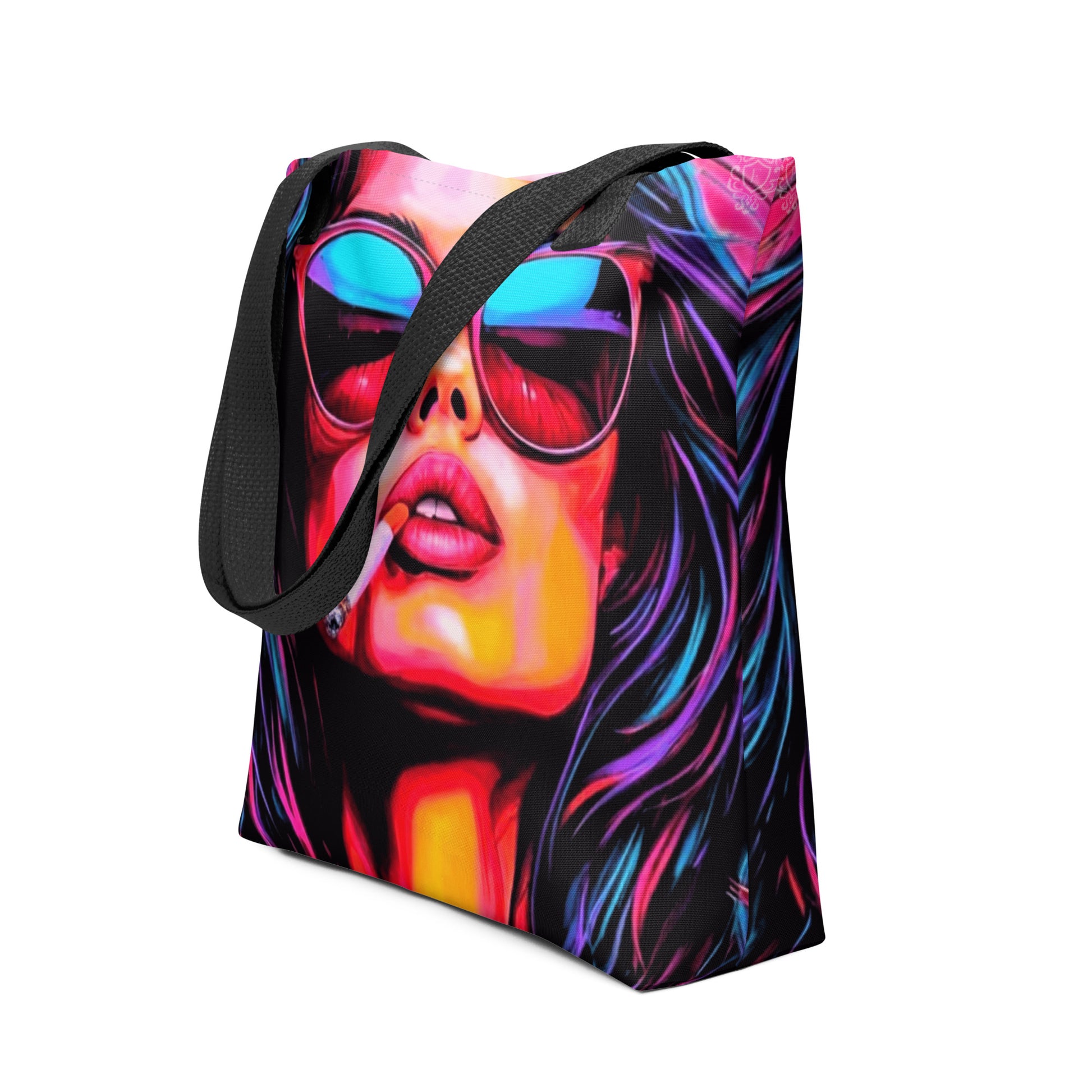 Front view of the 15 x 15 inch black all-over print Artistry Tote with 26 inch handles A canvas tote bag featuring a vibrant, colorful pop-art print of a woman's face wearing sunglasses, with black shoulder straps, shown against a plain white background.